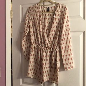 Long sleeved romper with red and black patterns